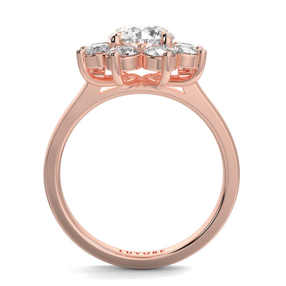 Rose gold ring with three diamonds on a white background yb jewellers cluster halo ring engagement ring grain set halo round shape plain band