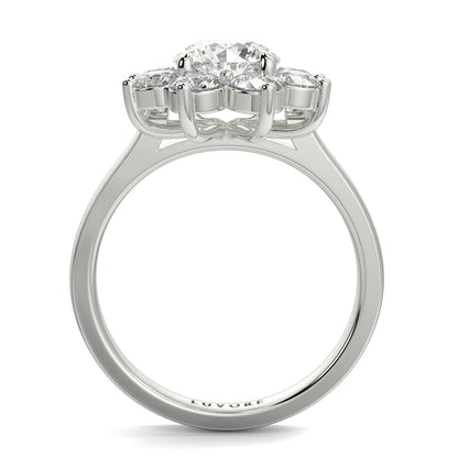 Diamond ring with four-prong setting on a white background yb jewellers cluster halo ring engagement ring grain set halo round shape plain band