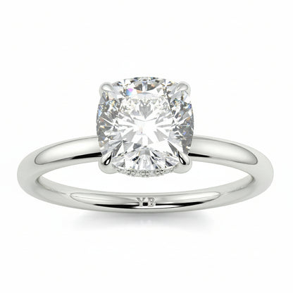 Diamond ring with branding on a white background yb jewellers solitaire engagement ring best selling design cushion shape diamond 4 claw with a slim band