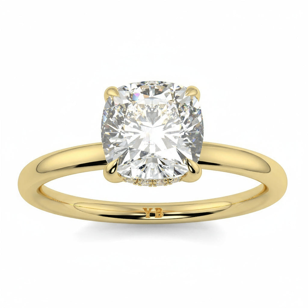 Gold ring with a large diamond on a white background yb jewellers solitaire engagement ring best selling design cushion shape diamond 4 claw with a slim band