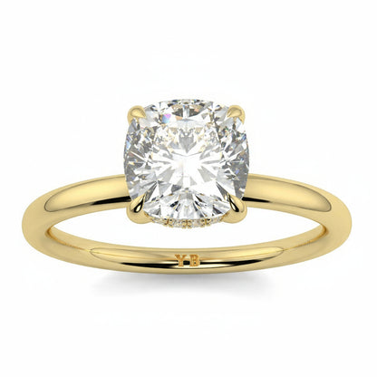 Gold ring with a large diamond on a white background yb jewellers solitaire engagement ring best selling design cushion shape diamond 4 claw with a slim band