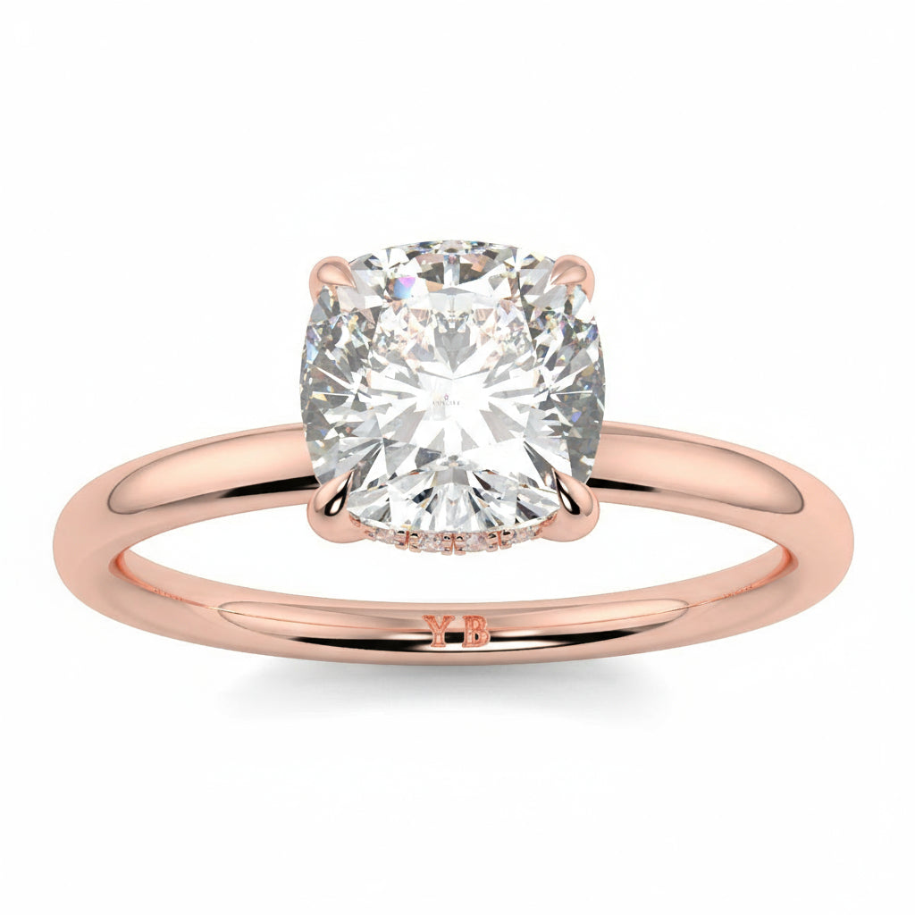 Rose gold ring with a large diamond on a white background yb jewellers solitaire engagement ring best selling design cushion shape diamond 4 claw with a slim band