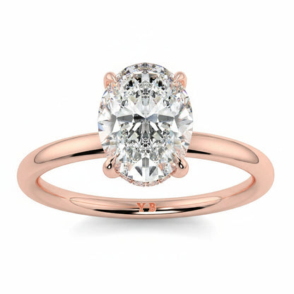 Rose gold ring with a large diamond on a white background yb_jewellers_solitaire_engagement_ring_best_selling_design_cushion_shape_diamond_4_claw_with_a_slim_band