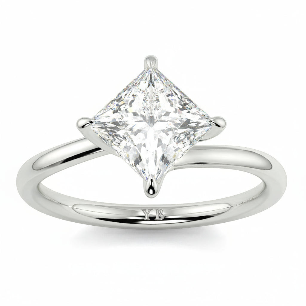 Silver ring with a princess-cut diamond on a white background yb_jewellers_twist_band_engagement_ring_best_selling_design_round_diamond_trending_rings