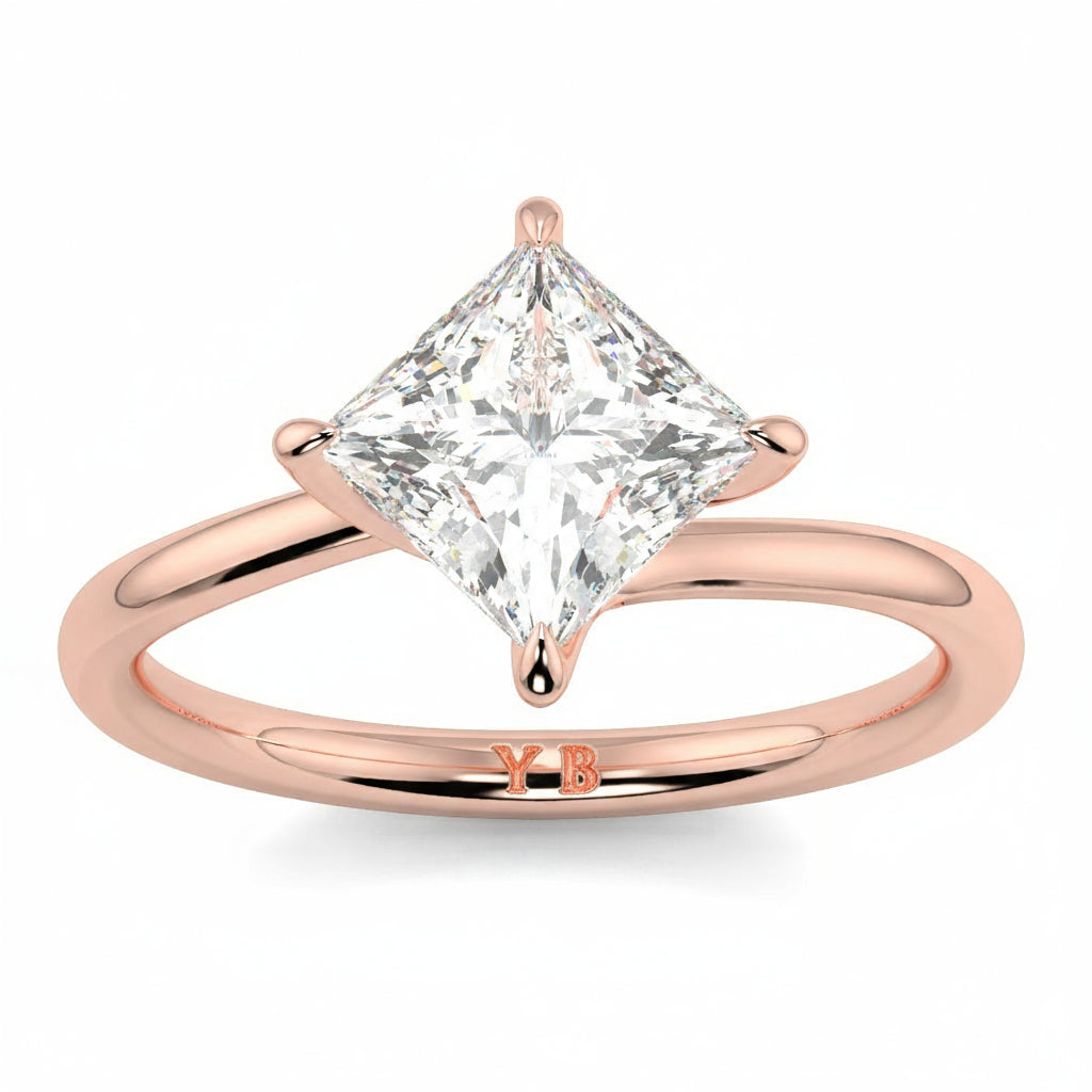 Rose gold ring with a princess-cut diamond on a white background yb_jewellers_twist_band_engagement_ring_best_selling_design_round_diamond_trending_rings