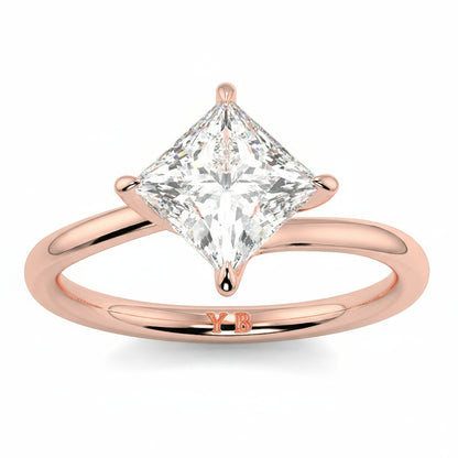 Rose gold ring with a princess-cut diamond on a white background yb_jewellers_twist_band_engagement_ring_best_selling_design_round_diamond_trending_rings