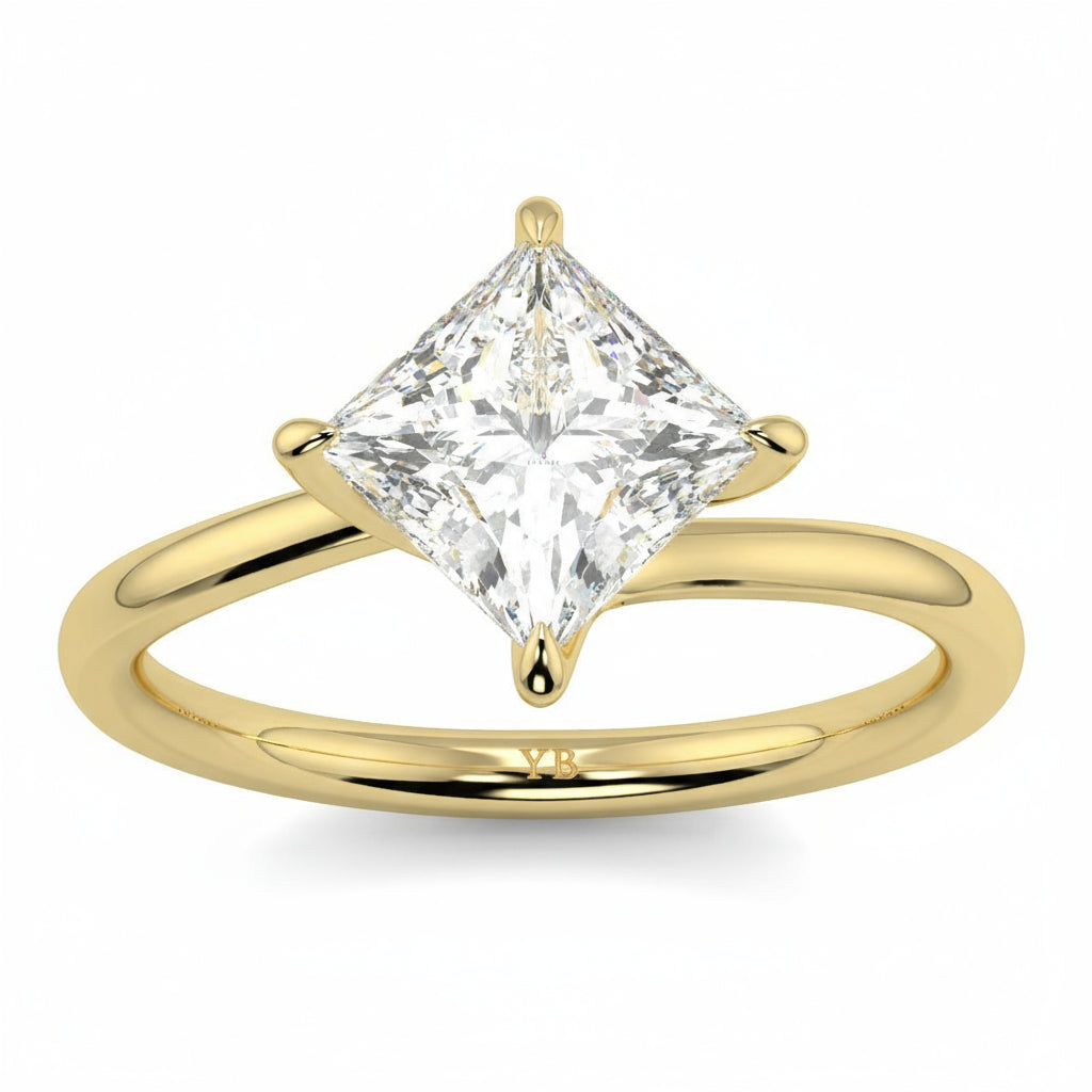 Gold ring with a princess-cut diamond on a white background yb_jewellers_twist_band_engagement_ring_best_selling_design_round_diamond_trending_rings