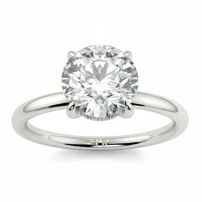 Diamond ring with 'Floyd' engraving on a white background _yb_jewellers_solitaire_engagement_ring_best_selling_design_cushion_shape_diamond_4_claw_with_a_slim_band