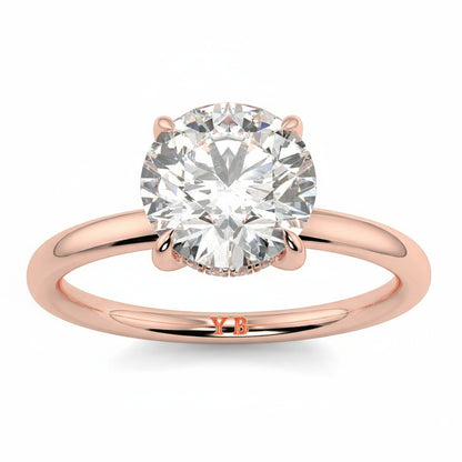 Rose gold ring with a large diamond and 'LUVORE' engraving on a white background _yb_jewellers_solitaire_engagement_ring_best_selling_design_cushion_shape_diamond_4_claw_with_a_slim_band