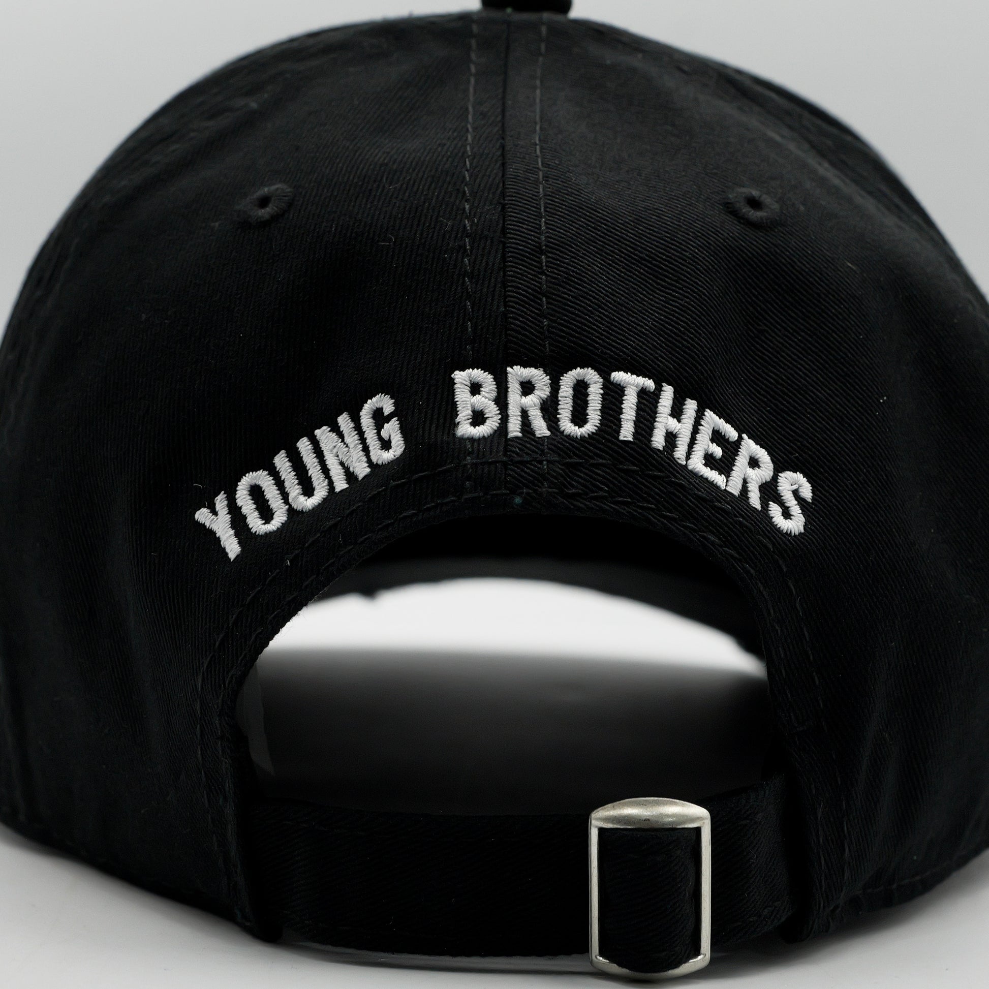 Black cap with 'YOUNG BROTHERS' embroidery on a gray background
