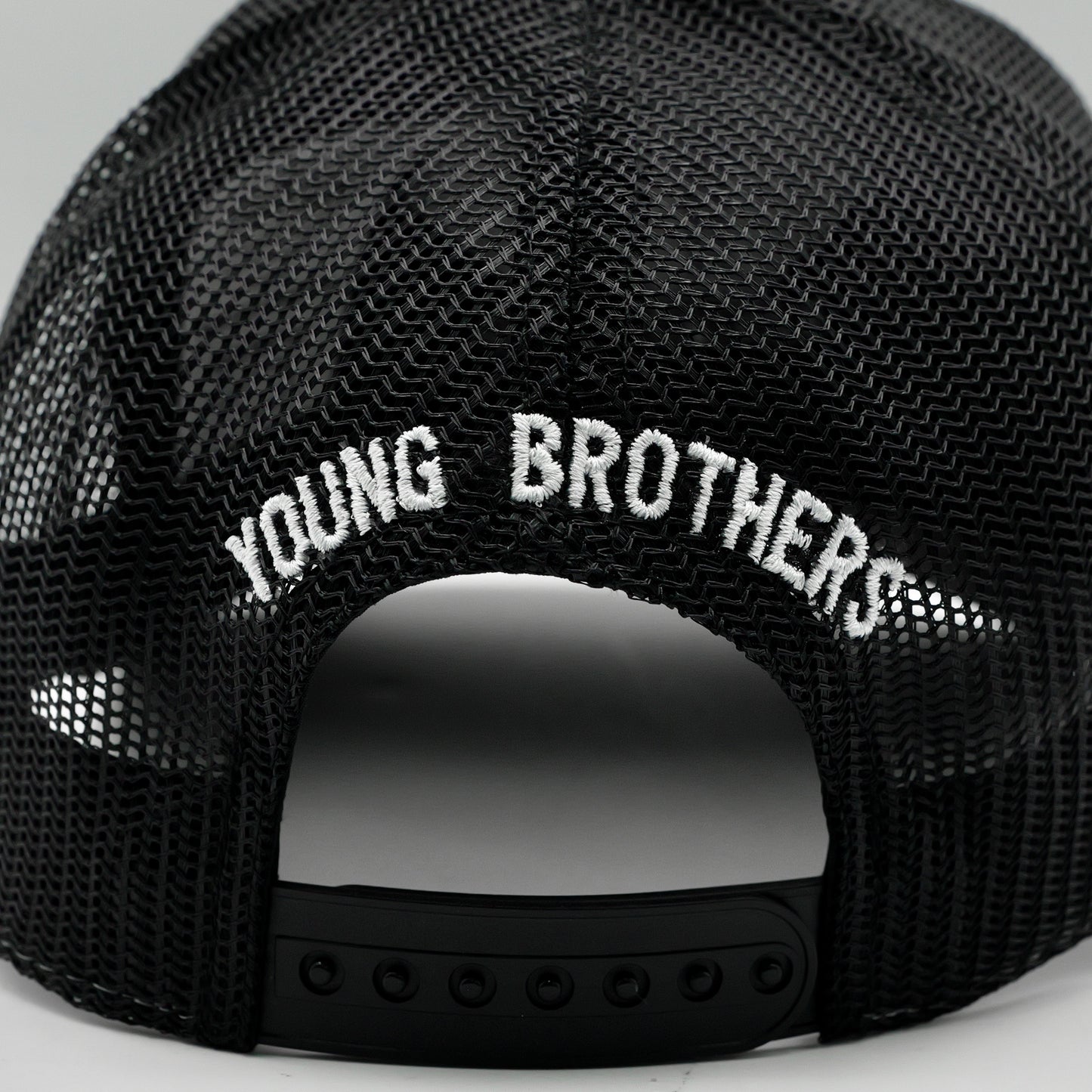 Black mesh cap with 'YOUNG BROTHERS' text on a gray background