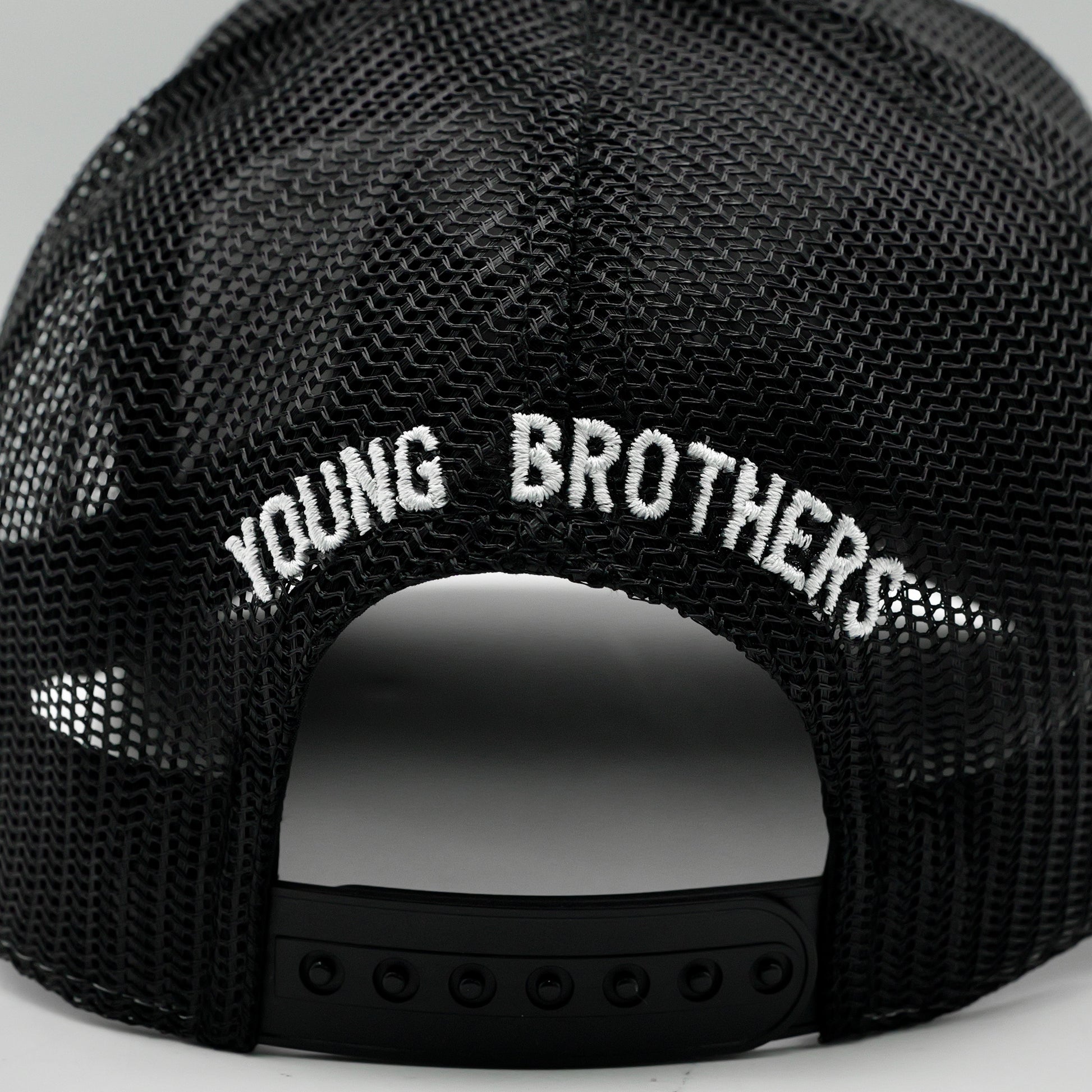 Black mesh cap with 'YOUNG BROTHERS' text on a gray background