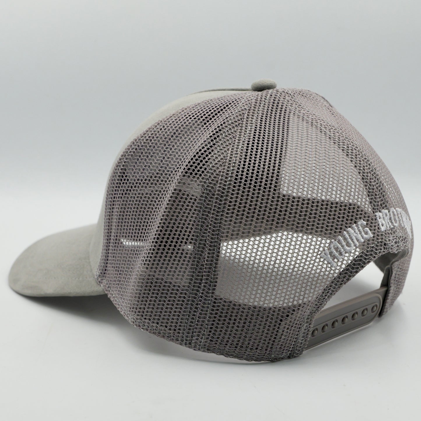 Gray mesh cap with brand logo on a light gray background