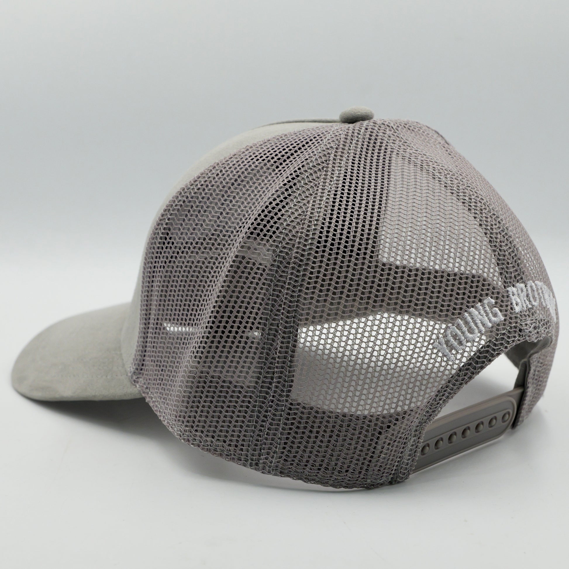 Gray mesh cap with brand logo on a light gray background