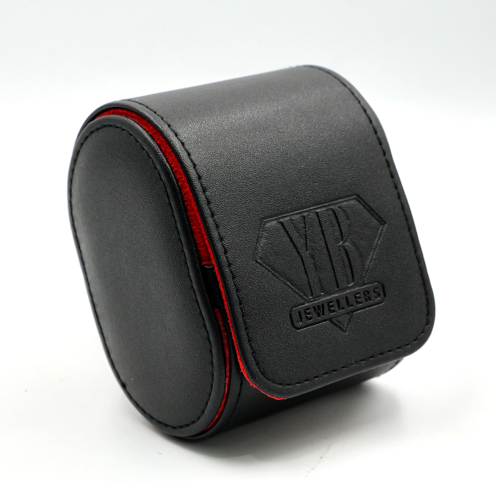 Black jewelry box with red interior on a white background