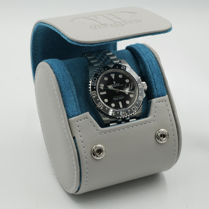 Watch in a gray and blue display case on a white background