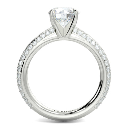 Silver ring with a large diamond and smaller diamonds on the band against a white background yb jewellers