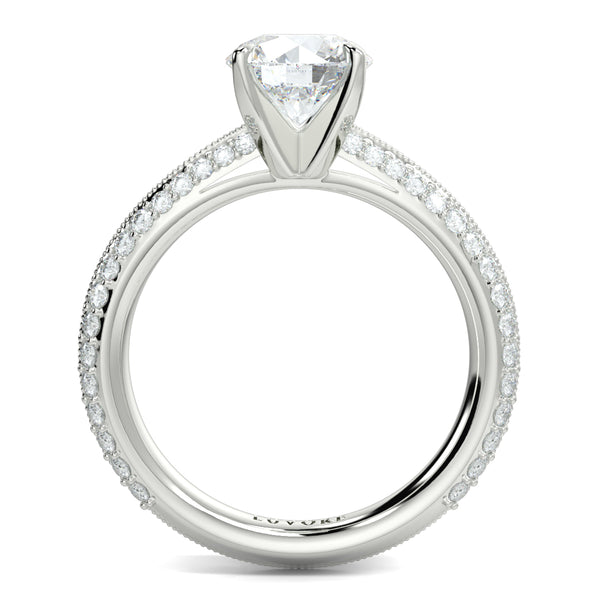 Silver ring with a large diamond and smaller diamonds on the band against a white background yb jewellers