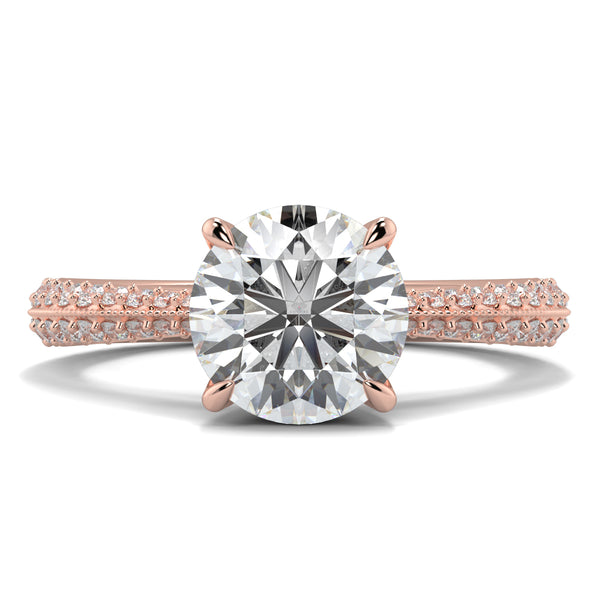 Rose gold diamond ring with a large central diamond and smaller diamonds on the band against a white background  YB Jewellers