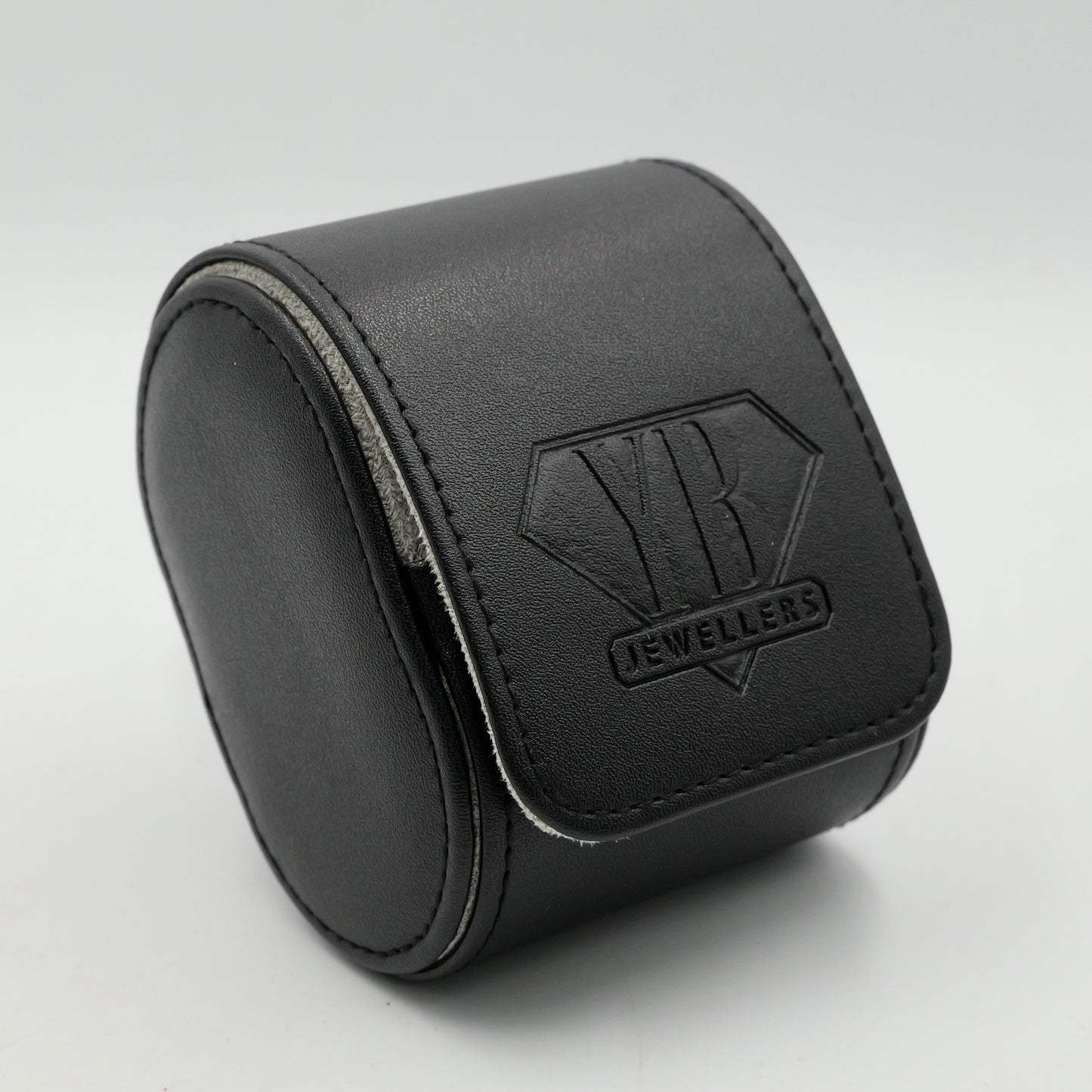 Black jewelry box with 'Yb Jewellers' logo on a light gray background