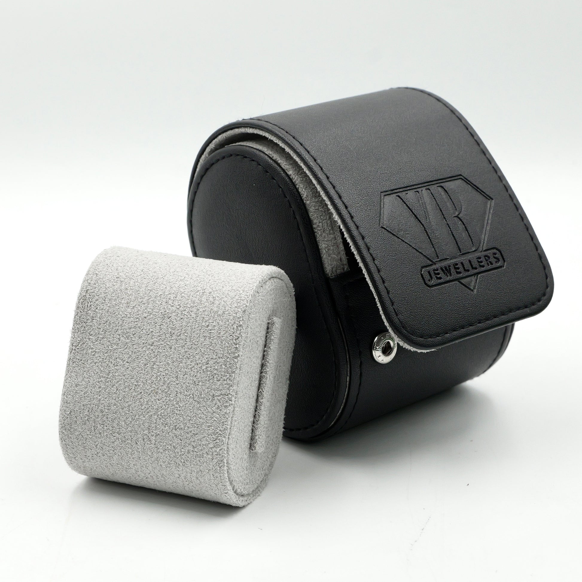 Black jewelry case with a textured gray interior on a white background, featuring the YB Jewellers' logo.