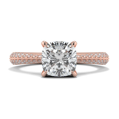 Rose gold ring with a large diamond and smaller diamonds on the band against a white background yb jewellers