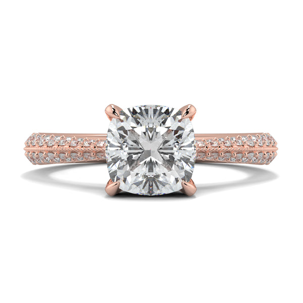 Rose gold ring with a large diamond and smaller diamonds on the band against a white background yb jewellers