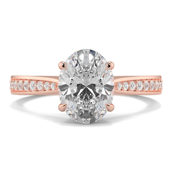 Rose gold ring with a large diamond and smaller diamonds on the band against a white background Yb jewellers engagement ring straight band