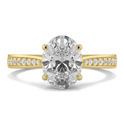 Gold ring with a large diamond and smaller diamonds on the band against a white background Yb jewellers engagement ring straight band