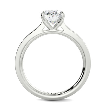 Silver ring with a heart-shaped diamond on a white background Yb jewellers engagement ring straight band
