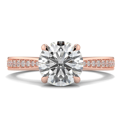 Rose gold ring with a large diamond and smaller diamonds on the band against a white background Yb jewellers engagement ring straight band