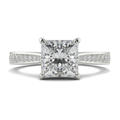 Diamond ring with a princess-cut center stone on a white background Yb jewellers engagement ring straight band princess cut diamond