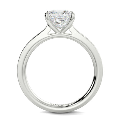 Diamond ring with a heart-shaped center stone on a white background Yb jewellers engagement ring straight band princess cut diamond
