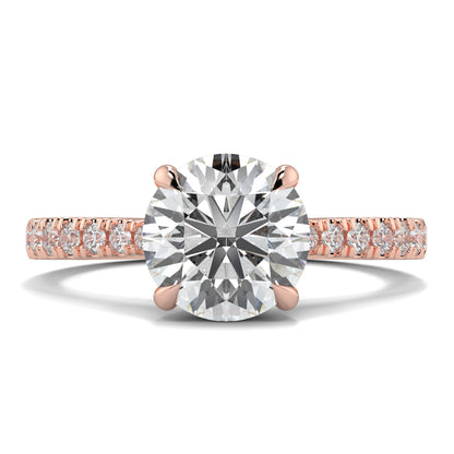 Rose gold ring with a large diamond and smaller diamonds on a white background Yb jewellers engagement ring straight band
