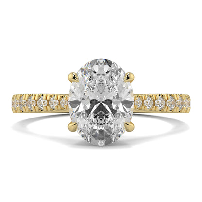 Gold ring with a large diamond and smaller diamonds on the band against a white background Yb jewellers engagement ring straight band