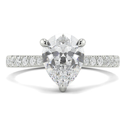 Diamond ring with a pear-shaped center stone on a white background Yb jewellers engagement ring straight band pear diamond