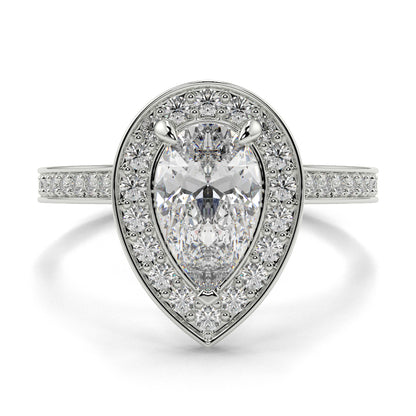 Diamond ring with pear-shaped center stone and halo on a white background Pear shaped diamond engagement ring Yb jewellers trending ring designs