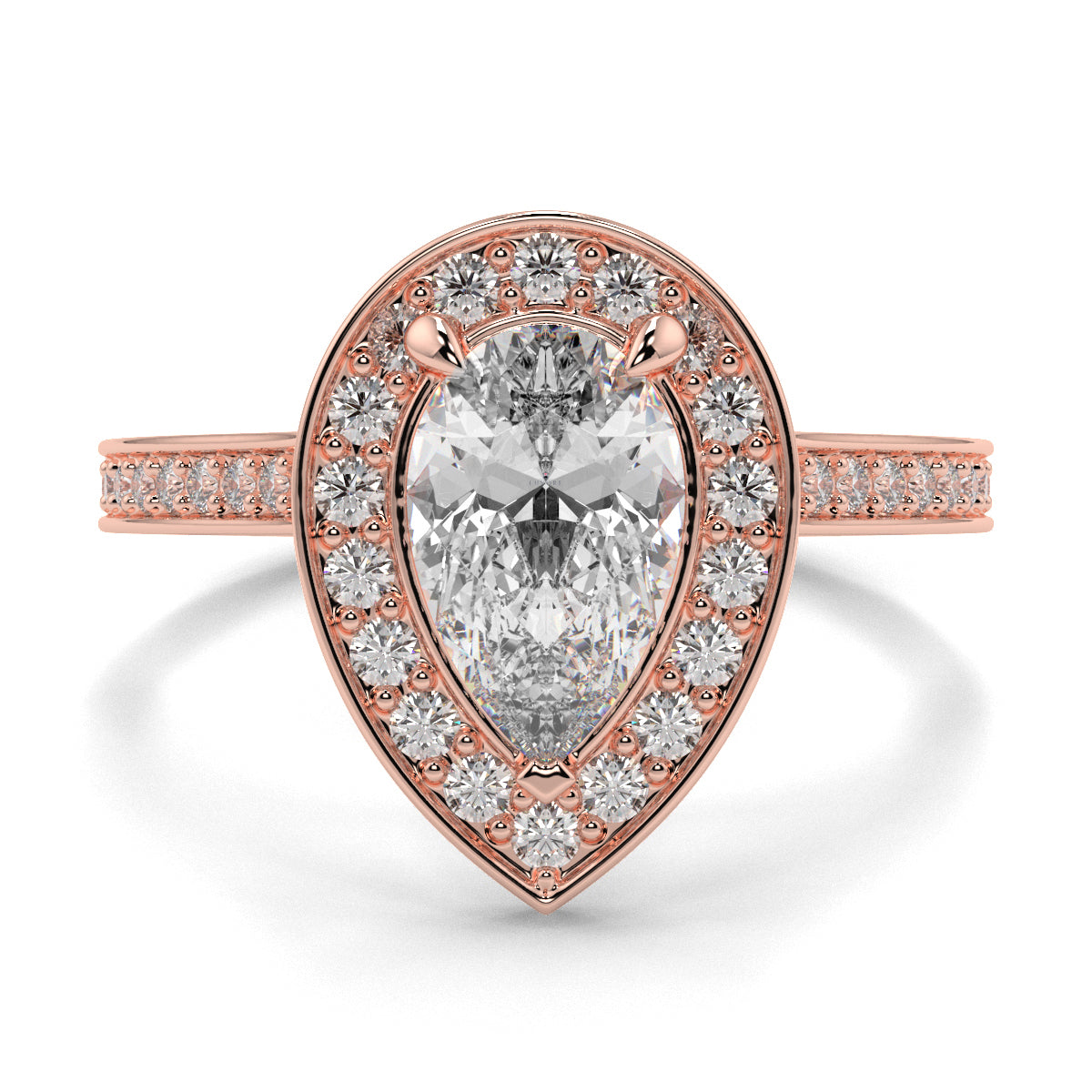 Rose gold ring with a pear-shaped diamond and smaller diamonds on a white background Pear shaped diamond engagement ring Yb jewellers trending ring designs
