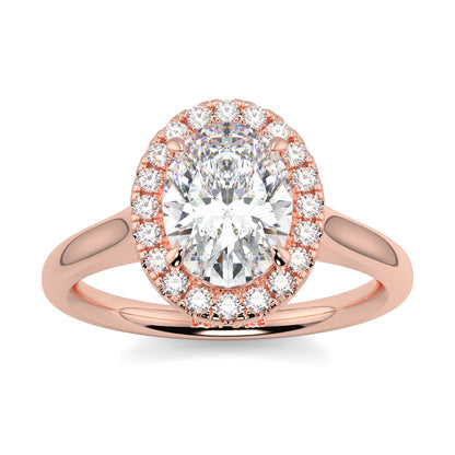 Rose gold ring with a large central diamond and smaller diamonds around on a white background yb jewellers iamond halo with plain shoulder oval shape 