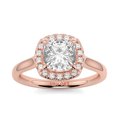 Rose gold ring with a large diamond and smaller diamonds around on a white background single halo with plain shoulder diamond engagement ring yb jewellers best seller trending ring 