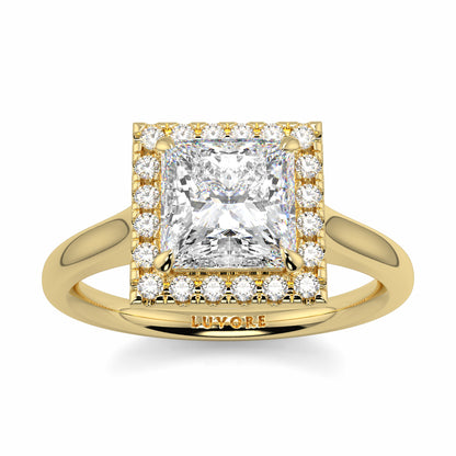 Gold ring with a large diamond and smaller diamonds on a white background Yb jewellers princess cut diamond halo plain shoulders 