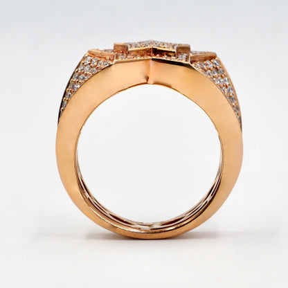 Rose gold ring with diamond accents on a white background