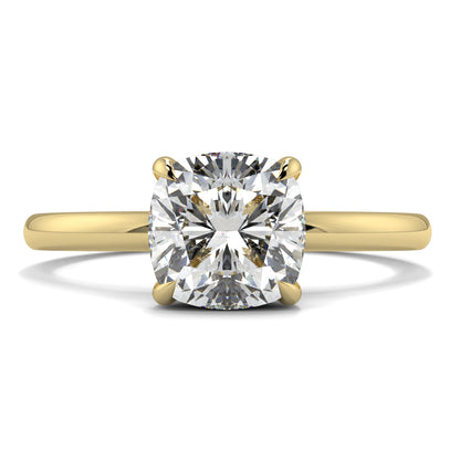 Gold ring with a large diamond on a white background yb jewellers solitaire engagement ring best selling design cushion shape diamond 4 claw with a slim band