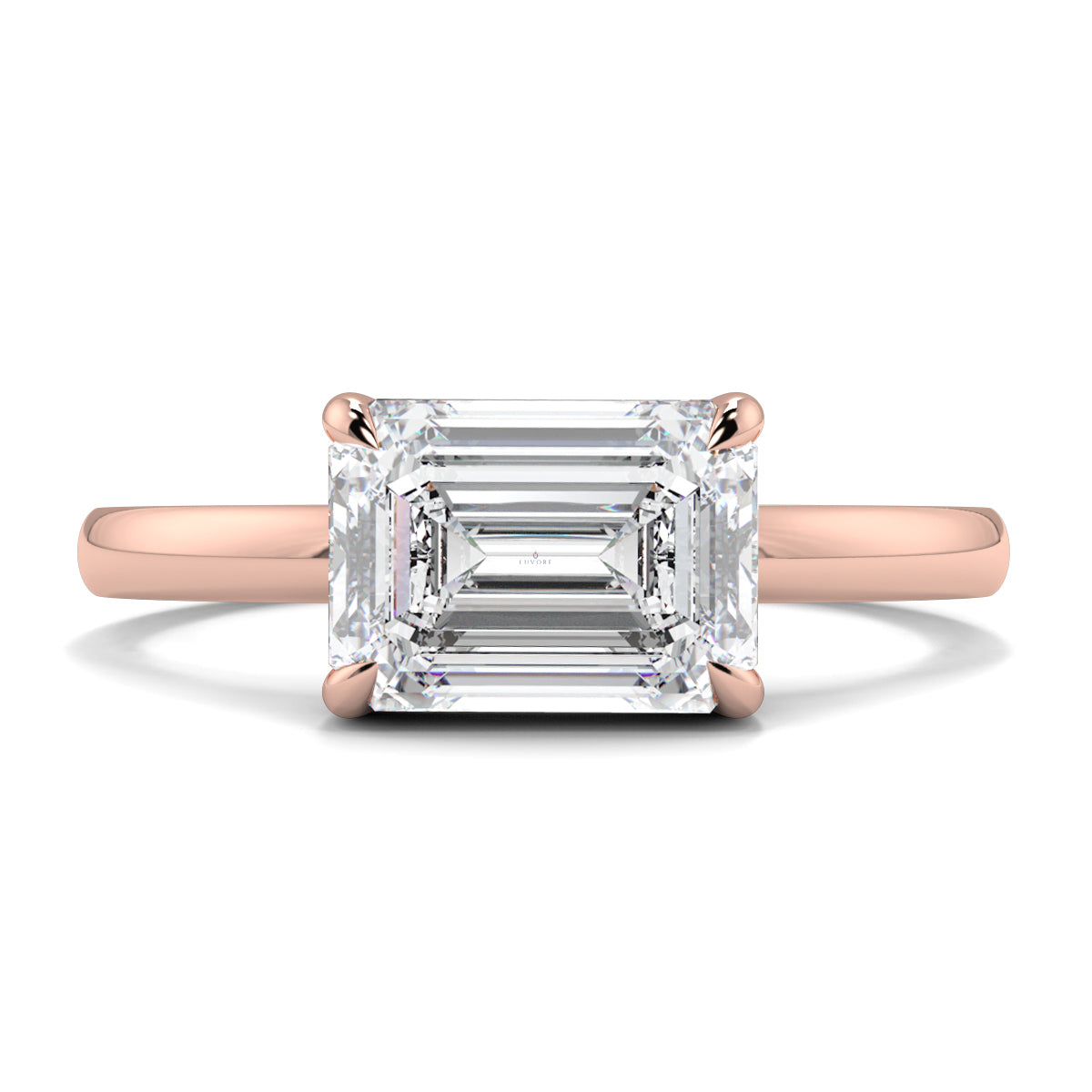 Rose gold ring with a large emerald-cut diamond on a white background yb jewellers 4 claw emerald diamond engagement ring best selling design with a thin band 