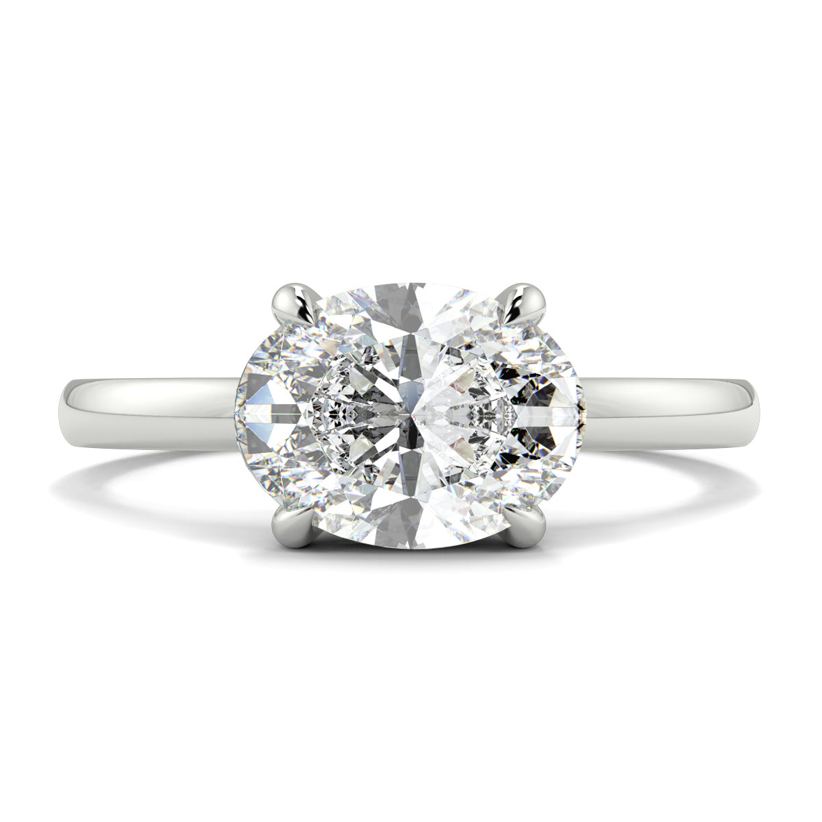 Diamond ring on a white background yb_jewellers_4_claw_emerald_diamond_engagement_ring_best_selling_design_with_a_thin_band