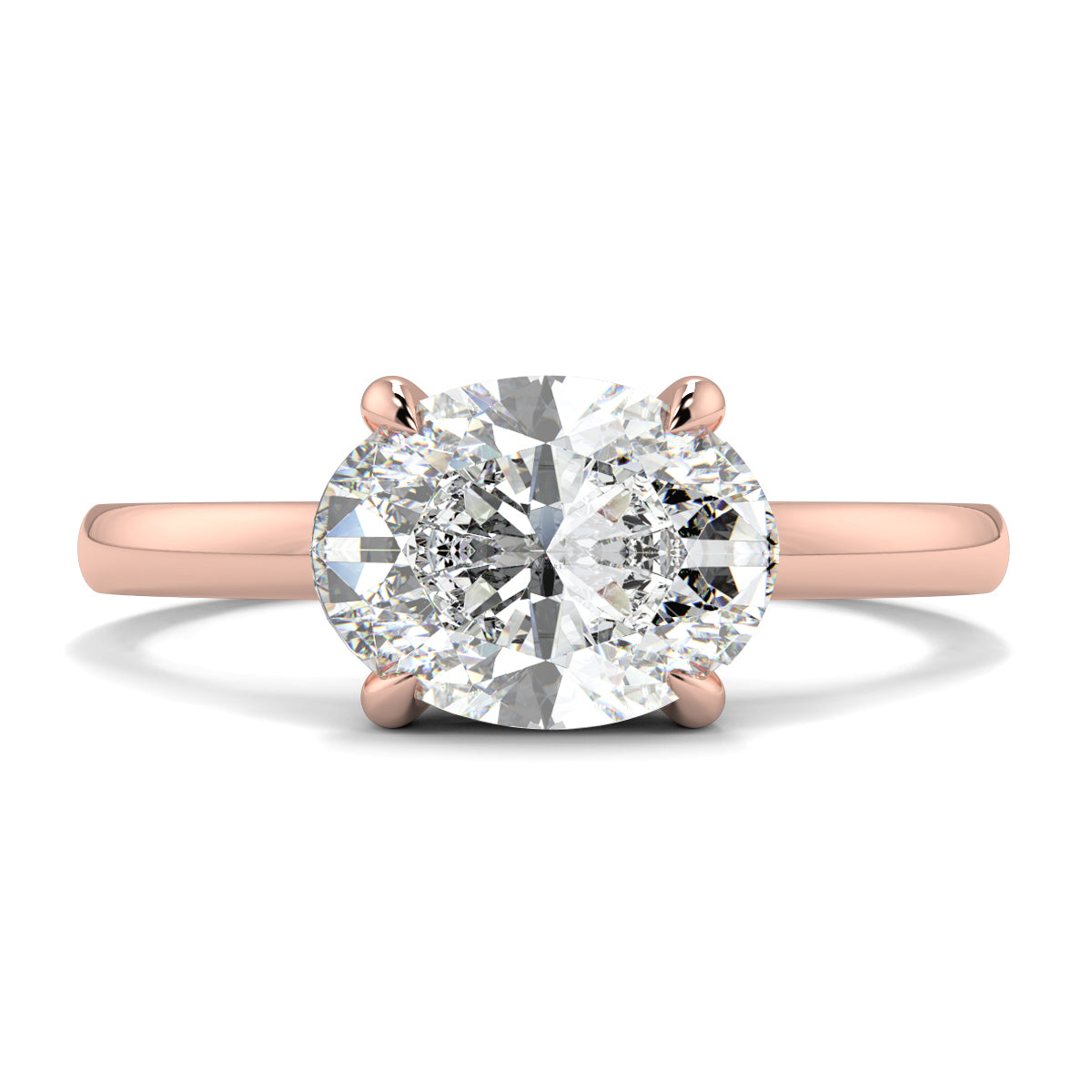 Rose gold ring with a large diamond on a white background yb_jewellers_4_claw_emerald_diamond_engagement_ring_best_selling_design_with_a_thin_band