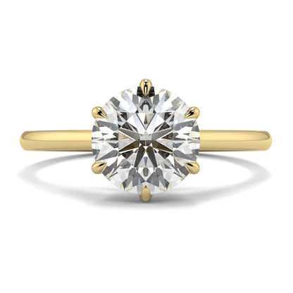 Gold ring with a large diamond on a white background yb jewellers solitaire engagement ring with 6 claws set similar to tiffany style classic engagement ring round solitare diamond ring yb jewellers trending jeweller and ring designs