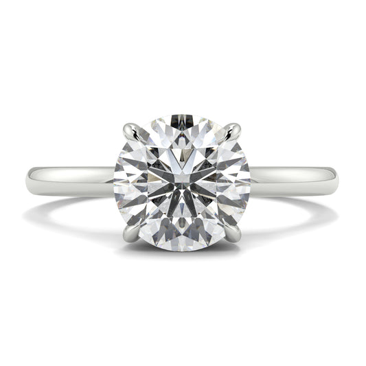 Diamond ring on a white background _yb_jewellers_solitaire_engagement_ring_best_selling_design_cushion_shape_diamond_4_claw_with_a_slim_band