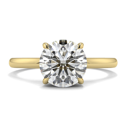 Gold ring with a large diamond on a white background _yb_jewellers_solitaire_engagement_ring_best_selling_design_cushion_shape_diamond_4_claw_with_a_slim_band