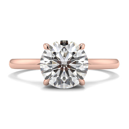 Rose gold ring with a large diamond on a white background _yb_jewellers_solitaire_engagement_ring_best_selling_design_cushion_shape_diamond_4_claw_with_a_slim_band